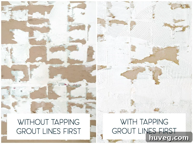 dislodging-old-shower-tiles-easily-by-tapping-the-grout-lines-with-a-putty-knife-blade-first