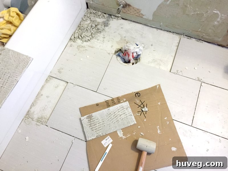 Master bathroom floor tile fix in progress
