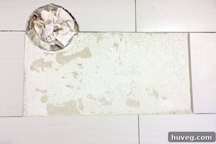 Closeup of removed tile area, showing old adhesive