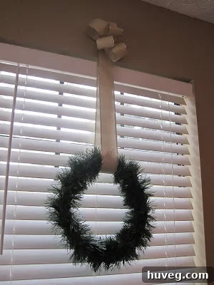 Another view of a DIY window wreath, showing simplicity and elegance.
