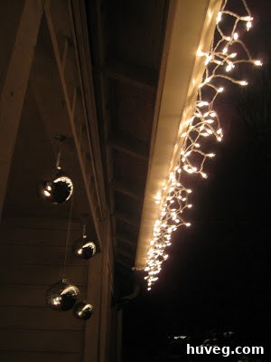 Christmas lights being plugged into an outdoor power source