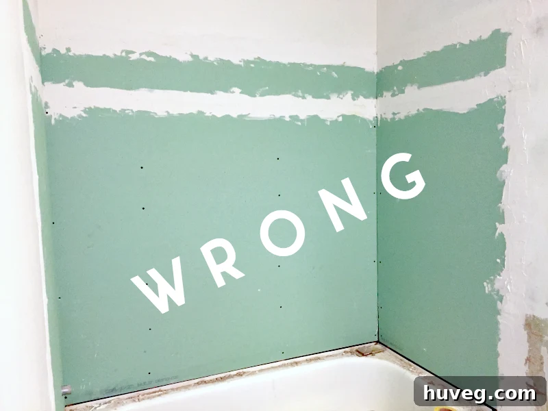 Green board drywall being identified as unsuitable material for wet area tiling