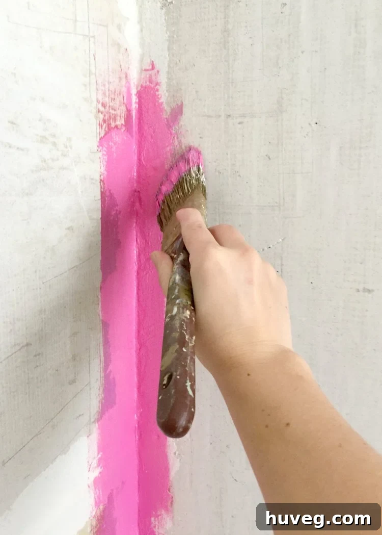 Redgard waterproofing applied to corners and seams of shower walls