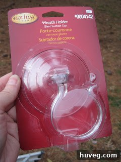 Heavy-duty suction cup with a hook, specifically designed for securely hanging large outdoor decorations like wreaths.