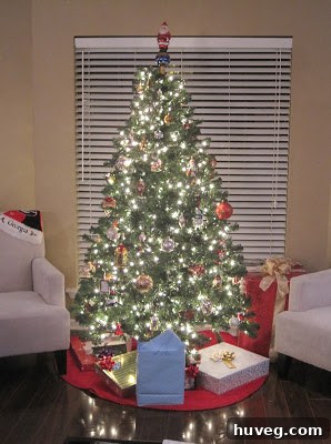 Our artificial Christmas tree, adorned with the first layer of lights and some early ornaments, symbolizing new beginnings in our home.