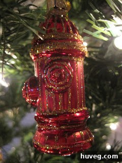 Another family-themed ornament, possibly representing individual family members or pets, adding a personal touch to the tree.