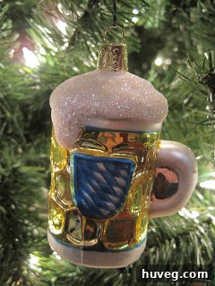 Another travel-themed ornament, perhaps from a different trip or representing a shared activity like hiking or sailing, symbolizing adventures.