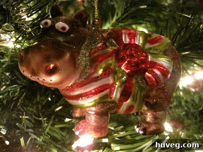 A whimsical and colorful ornament, possibly an animal or a playful character, adding a touch of humor and lightness to the Christmas tree.