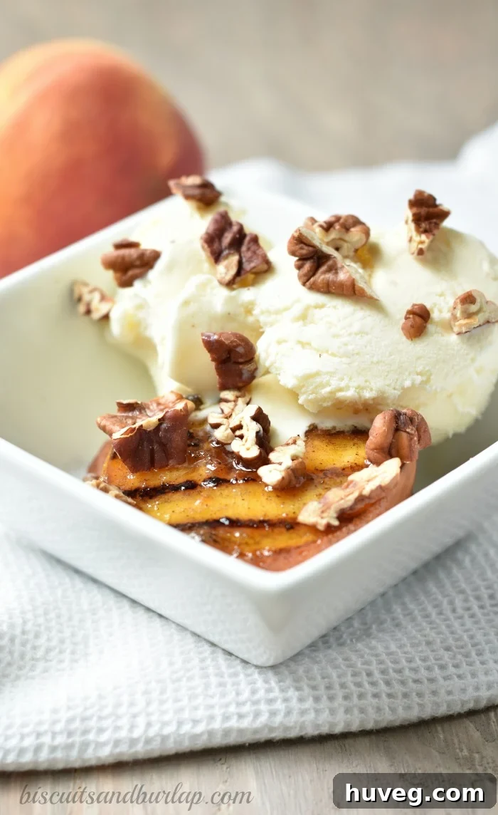 Warm Grilled Peaches with Toasted Pecans and Vanilla Ice Cream dessert