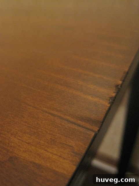 Close-up of the distressed finish on the kitchen table top.
