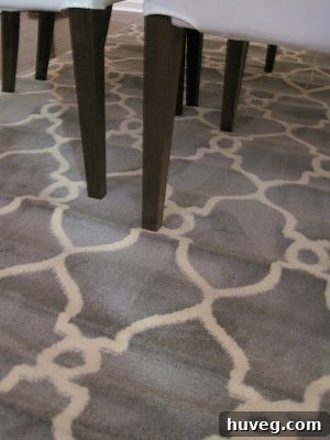 Dining room showing the new area rug partially unfurled