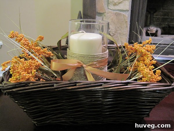 Thanksgiving centerpiece with ribbon on twine candle holder and fall berry stems