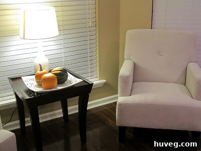 A cozy living space featuring newly installed flooring and comfortable chairs, set for holiday relaxation.