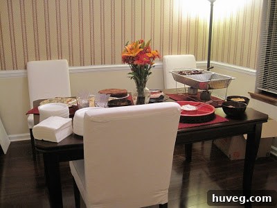 Guests enjoying conversation and food at the housewarming party.