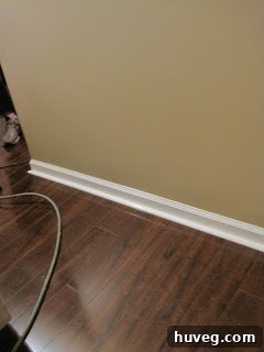 After shoe molding installation: A polished view of the floor with elegant trim concealing the expansion gap, presenting a refined and complete aesthetic.