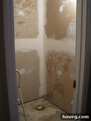 Powder room after initial renovation, showing new paint