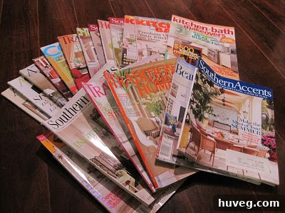 An opened box revealing a stack of various home decor magazines.
