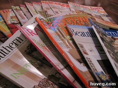 A stack of beautifully styled design magazines, ready for reading.