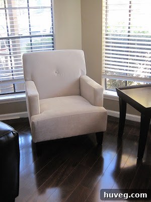 After: Stylish new $99 armchairs in the transformed living room, showcasing a blend of affordability and high-end design inspiration.