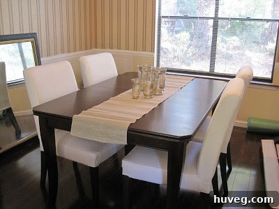 Another view of the renovated dining room, showcasing the new furniture, improved ambiance, and potential for future decor additions.