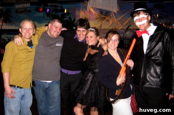 A couple dressed as Sarah Palin and the Monopoly Man for Halloween.