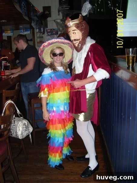 A woman dressed as a homemade piñata costume for a work Halloween party, made from tissue paper.
