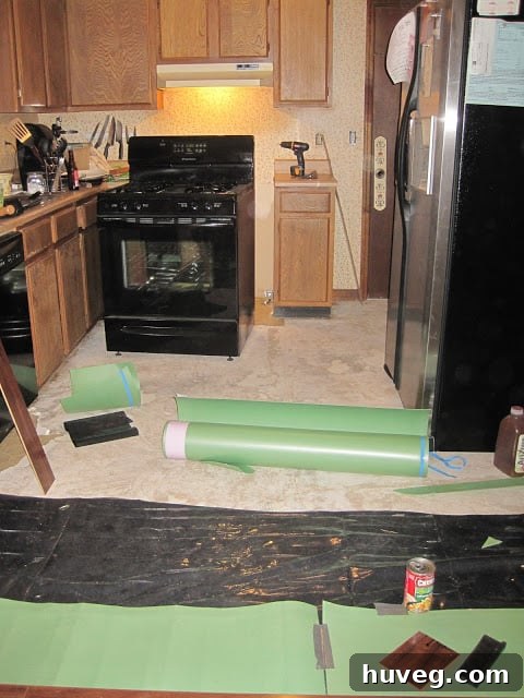 Almost finished kitchen floor, showing significant progress.