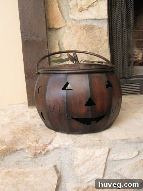 Early Halloween decoration prep featuring a charming metal pail, ready for festive filling.