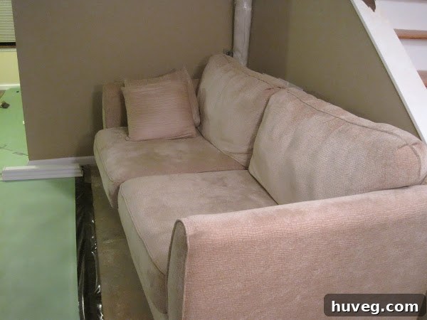Applying furniture pads to a couch leg