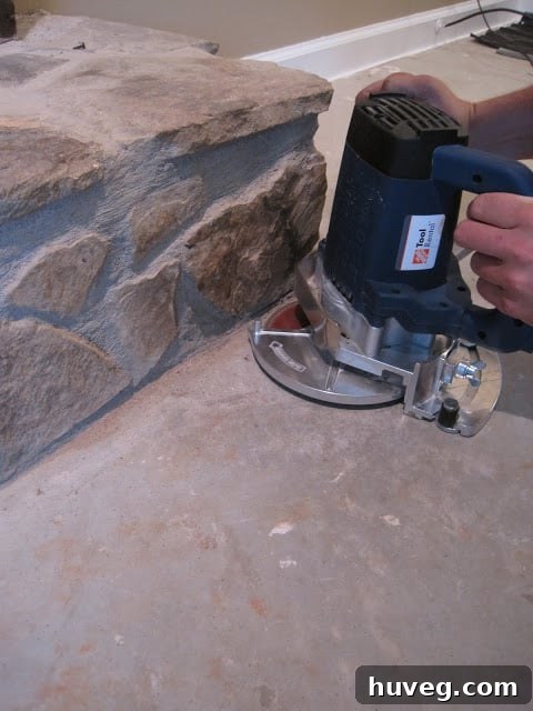 Uneven stone fireplace presenting a challenge for laminate flooring installation