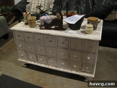 An antique apothecary-style cabinet with multiple drawers.
