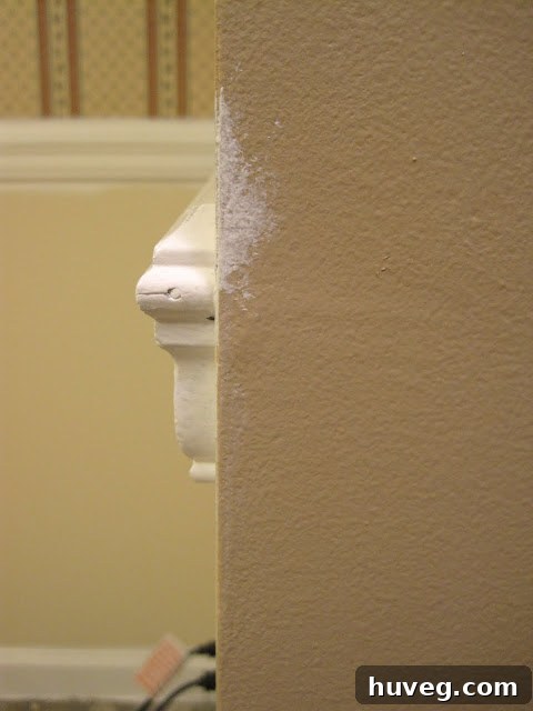 A paint mishap on the living room divider, showing accidental paint marks