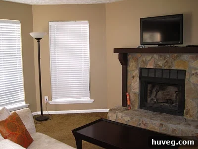 Current living room with a stone fireplace