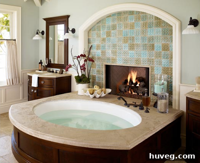 A luxurious bathroom featuring turquoise subway tiles, creating a spa-like atmosphere. White fixtures and subtle accents complete the refreshing look.