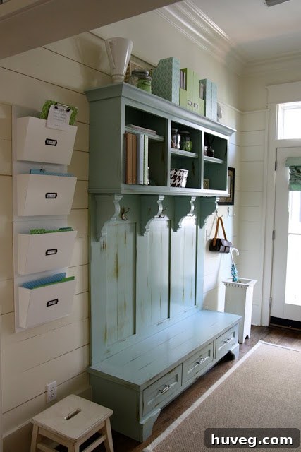 A functional yet stylish mudroom incorporating turquoise elements, possibly through painted cabinetry or accessories, showing how this color can brighten even utility spaces.