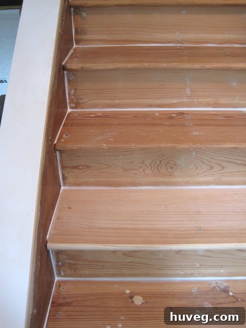 Stair Treads Being Prepared with Caulk Before Painting