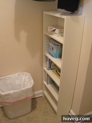 Ikea storage unit and small trash can for lint in renovated laundry room