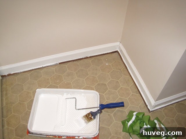Freshly painted laundry room baseboards during renovation
