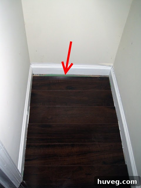 Finished craft room closet corner with a slight flooring gap