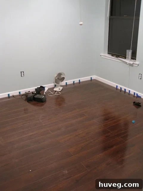 Completed flooring in a section of the craft room