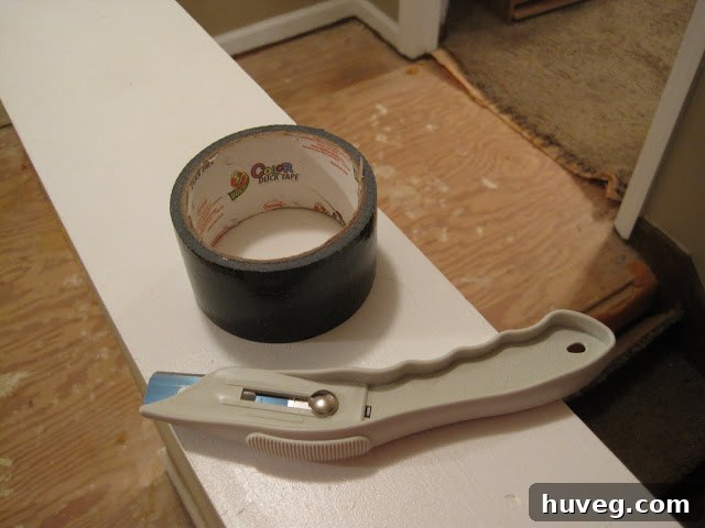 Angled utility knife for carpet cutting