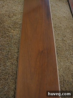 Laminate flooring sample of Caribbean Rosewood, close-up view.