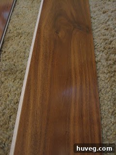 Laminate flooring sample of Exotic Walnut, close-up view.