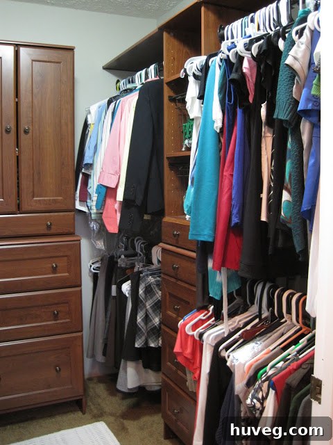 Partially organized closet with new white modular units installed