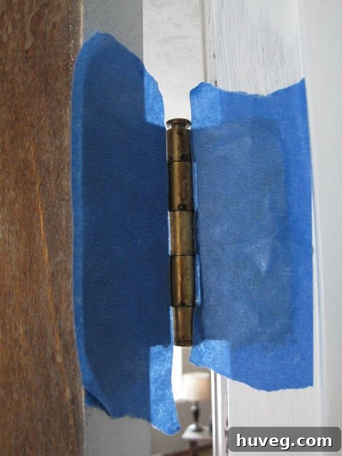 painters tape on door hinge
