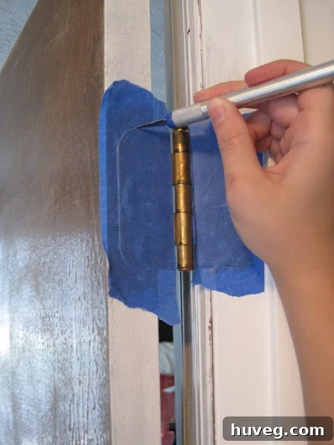 exacto knife on hinge with painters tape