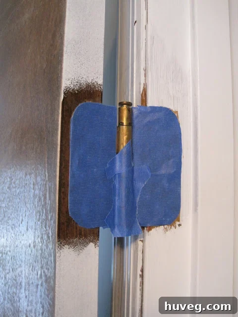 trim excess tape from door hinge