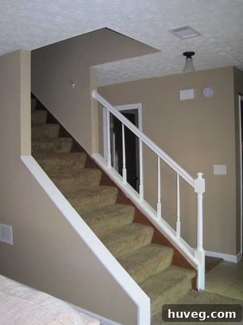 After Hallway: Walls painted Valspar Sandy Shell, bright white semi-gloss trim, new oil-rubbed bronze light fixture