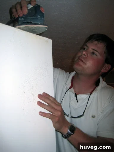 Close-up of a repaired door frame, now smooth and free of scuff marks, indicating successful adjustment and readiness for paint.