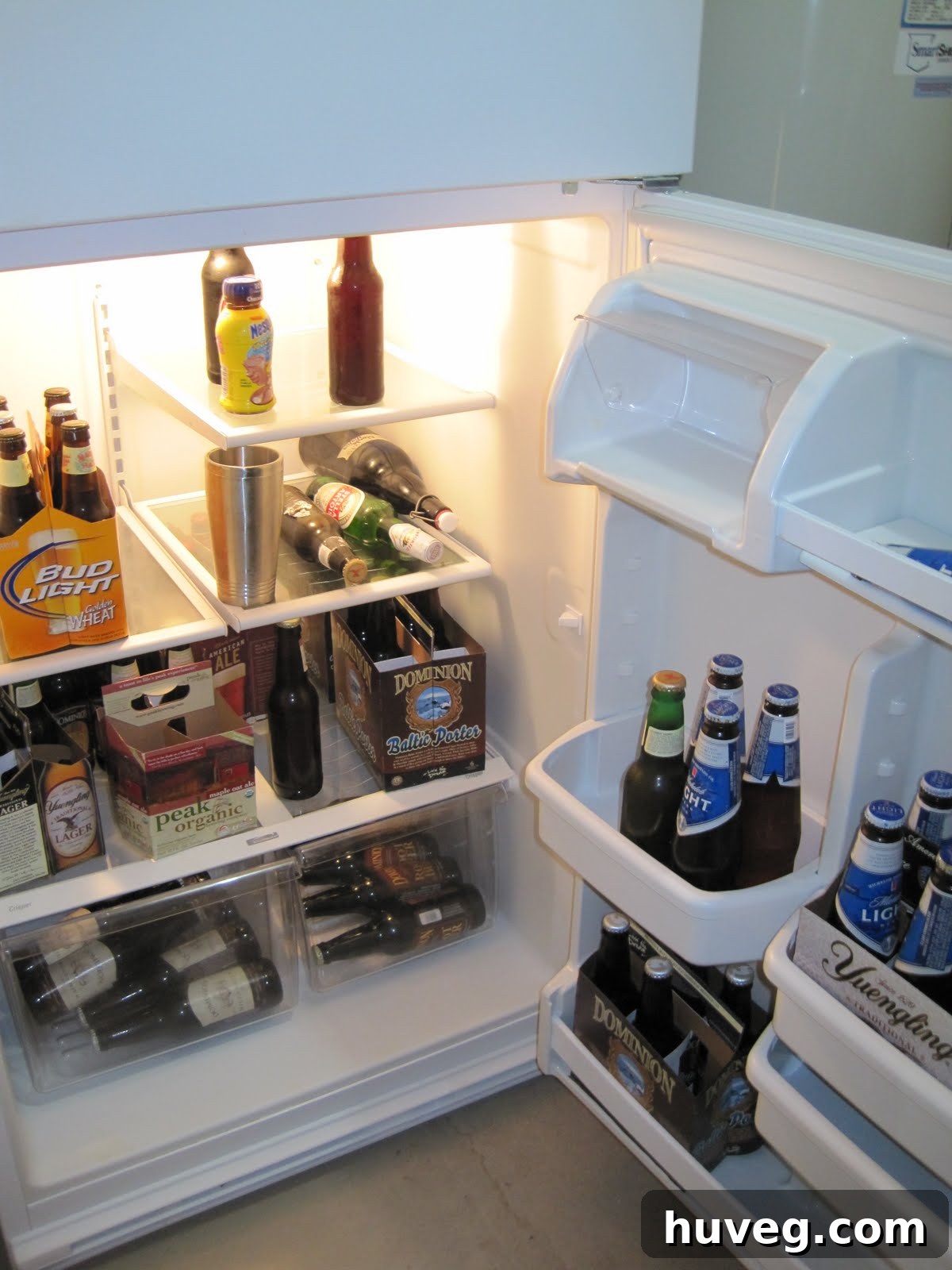 Beer fridge in garage next to workbench